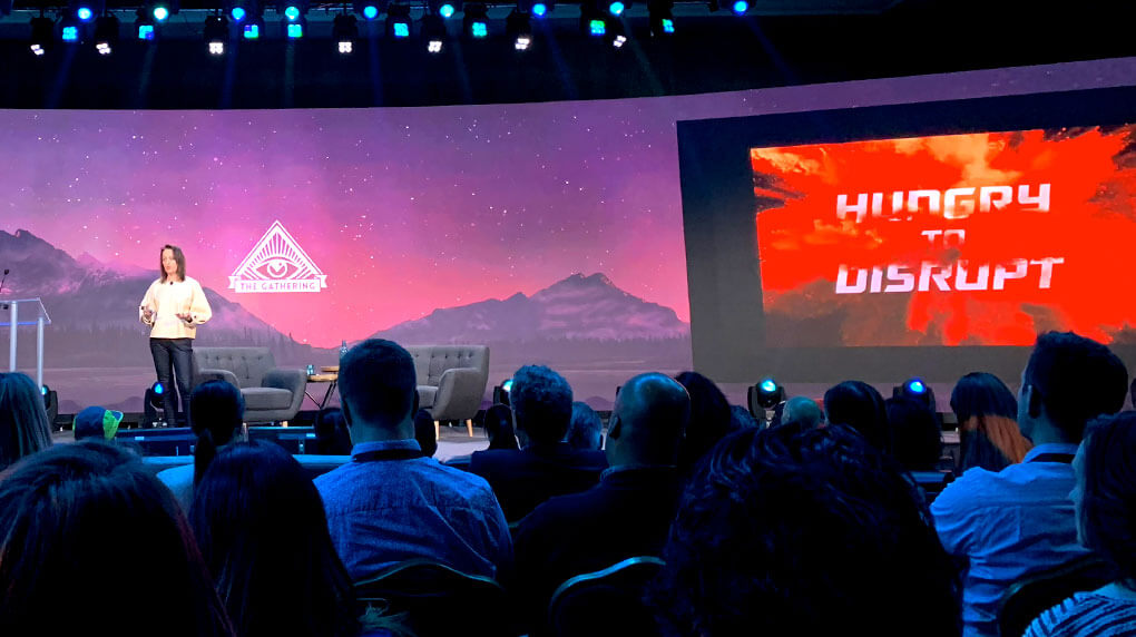 a speaker on stage at The Gathering